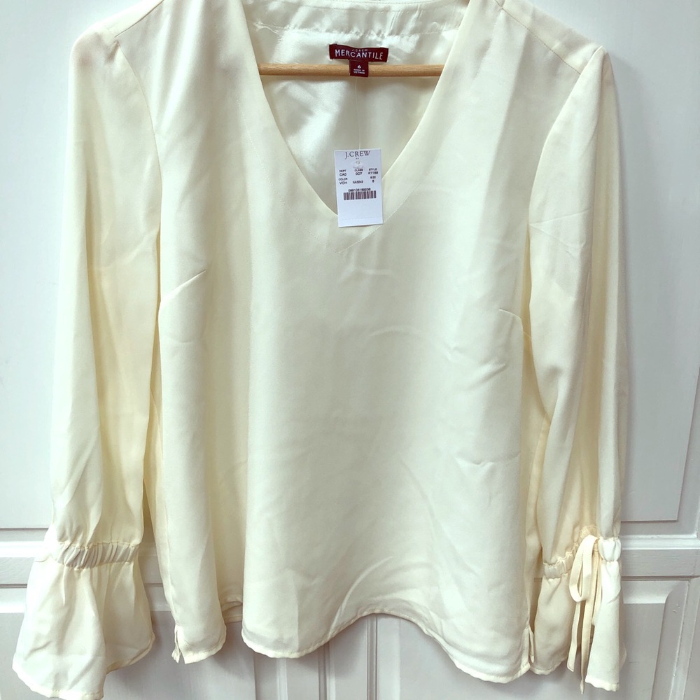J Crew cream colored pull over blouse